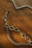 "DANCING WITH MYSELF" NICKEL CHAIN BELT