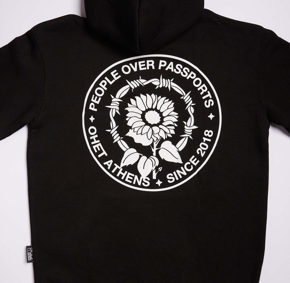 BLACK HOODIE PEOPLE OVER PASSPORTS
