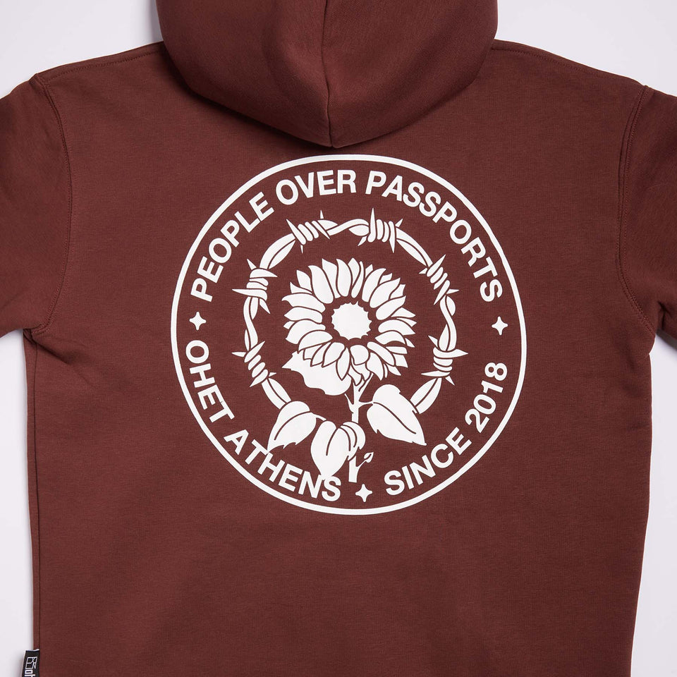 BROWN HOODIE PEOPLE OVER PASSPORTS