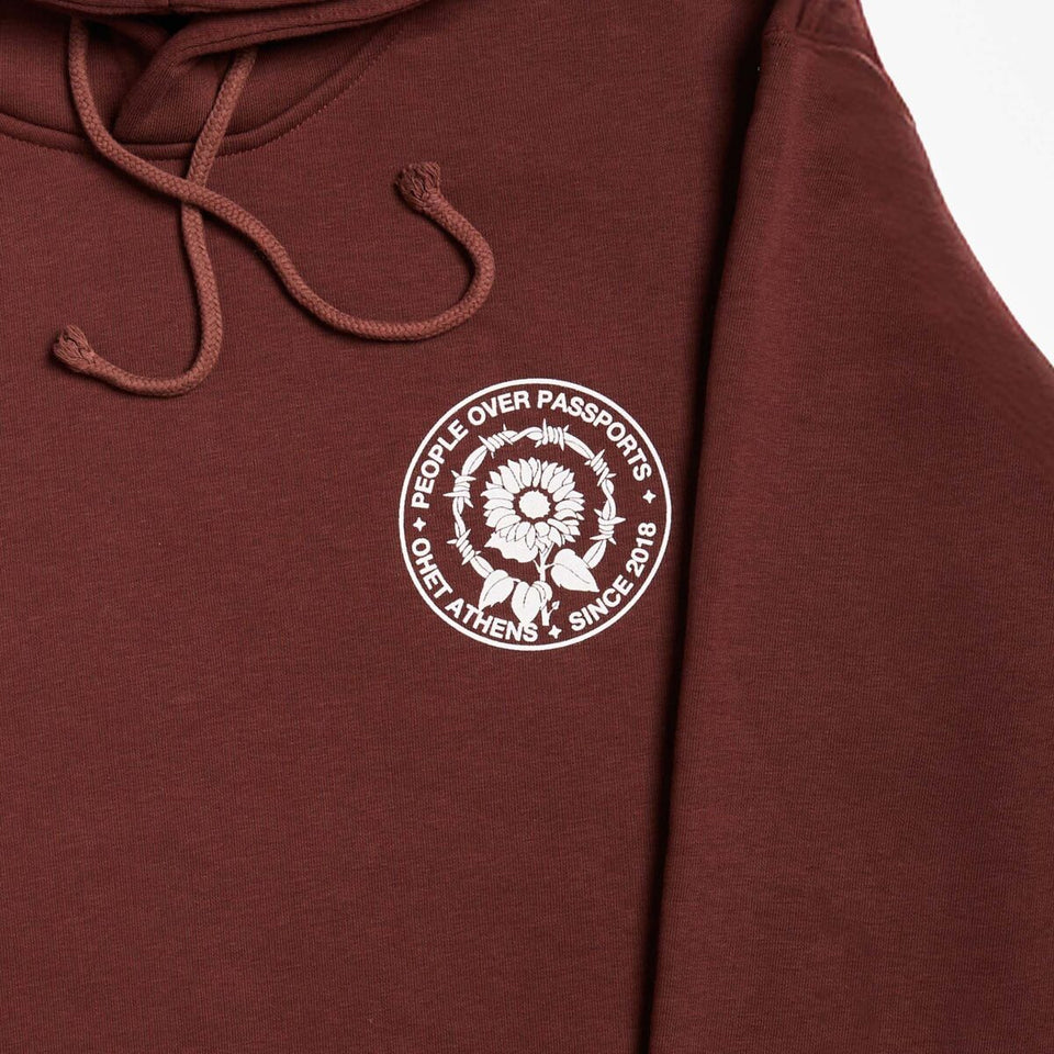 BROWN HOODIE PEOPLE OVER PASSPORTS