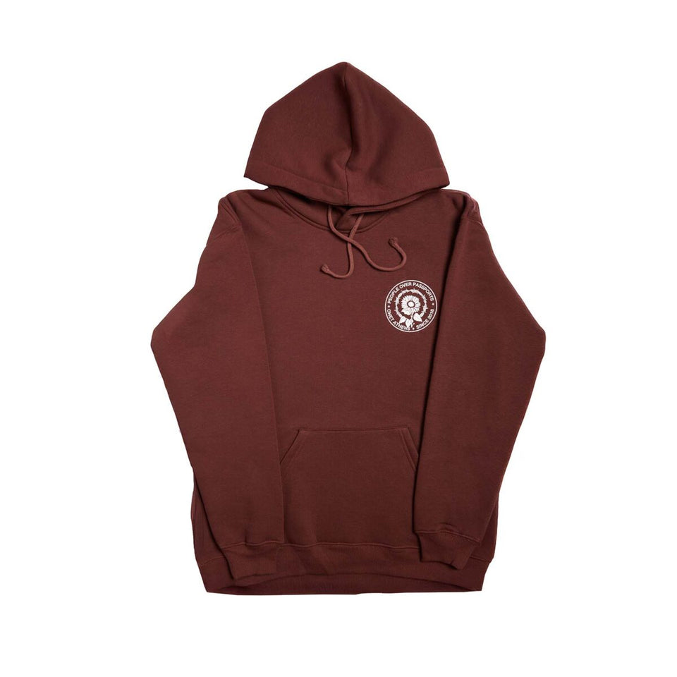 BROWN HOODIE PEOPLE OVER PASSPORTS