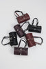 "ENDLESSLY" BLACK NICKEL BARREL BAG